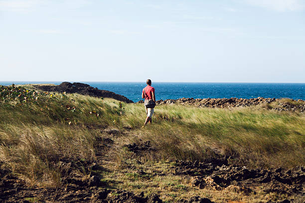istock Man hiking at the beach 472139583
