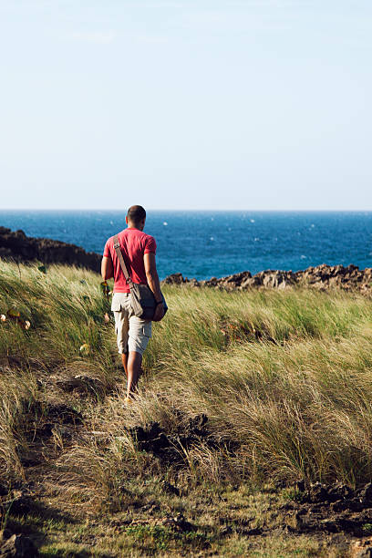 istock Man hiking at the beach 472139651