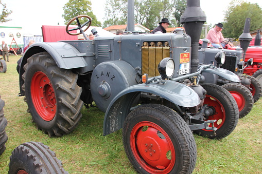 Otterfing, Germany - September 4, 2011: This old Lanz tractor was at the vintage car exhibition in Otterfing - bayern. Here is organized every year a vintage car rally. The people admired the old tractor.
