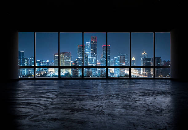 istock Beautiful city skyline seen through windows at night 472141825