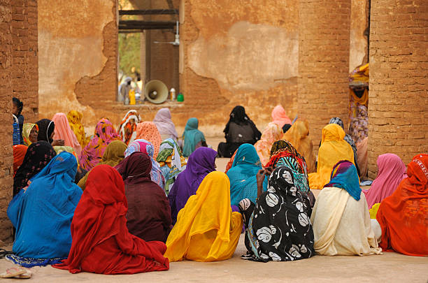 Colorful women during prayer in mosque, Kassala, Sudan stock photo