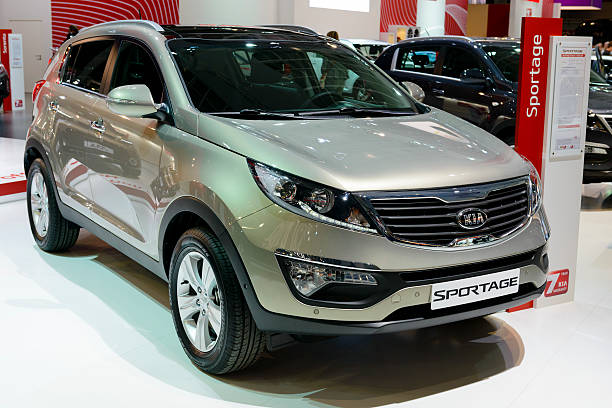 Kia Sportage Brussels, Belgium - January 14, 2014: Kia Sportage compact suv on display at the 2014 Brussels motor show. People in the background are looking at the cars. 2014 stock pictures, royalty-free photos & images