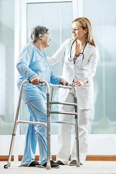 istock Happy healthcare worker with a patient. 472144125