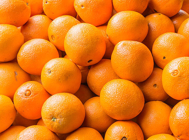 istock Mandarin oranges on market 472144490