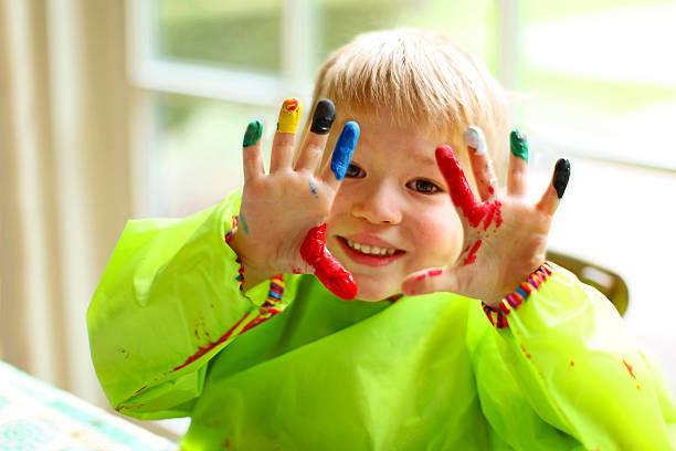 Happy Child Showing Painted Hands