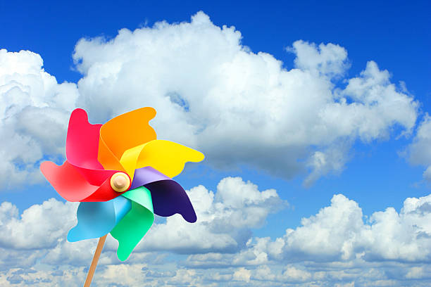 istock Colorful Pinwheel (windmill) Against Blue Sky 472144982