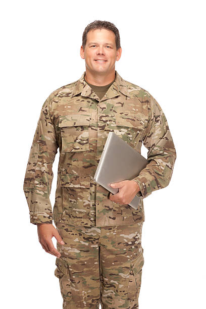 istock U.S. Army Soldier, Sergeant. Isolated and holding laptop. 472145062