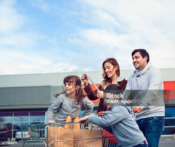 Family After Shopping On Parking Lot Stock Photo - Download Image Now - Family, Supermarket, Shopping