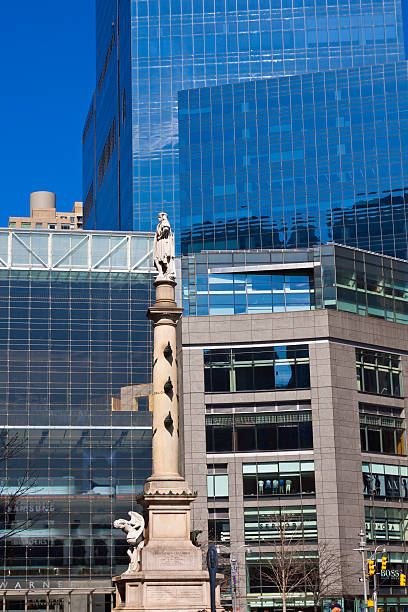 Columbus Circle, New York City. New York, NY, USA - April 2, 2010: Columbus Circle, New York City. In the middle is the statue of Columbus by Gaetano Russo, Time Warner Center is in background. Columbus Circle, named for Christopher Columbus, is a traffic circle in Manhattan, located at the intersection of Eighth Avenue, Broadway, Central Park South (West 59th Street), and Central Park West, at the southwest corner of Central Park. time warner center columbus circle pictures stock pictures, royalty-free photos & images