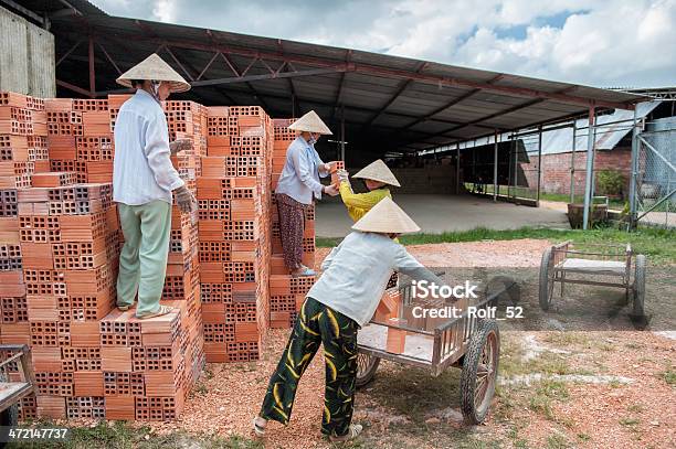 Vietnamese Women Working In A Brickyard Stock Photo - Download Image Now - Adult, Asia, Blue-collar Worker