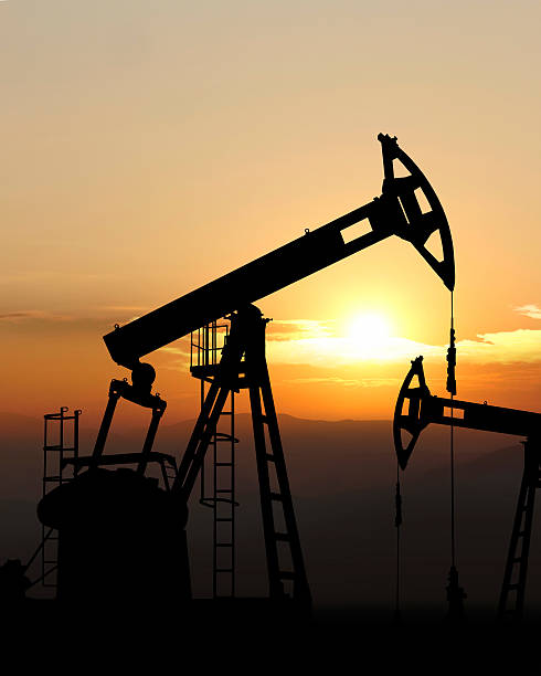 oil pump jack silhouette stock photo