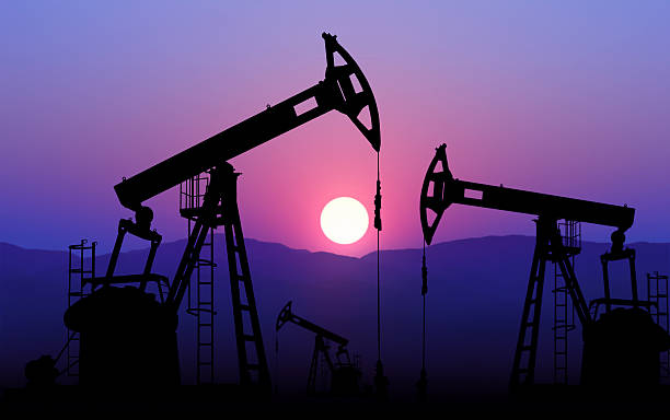 oil well pump oil well plant against sunset oil field stock pictures, royalty-free photos & images