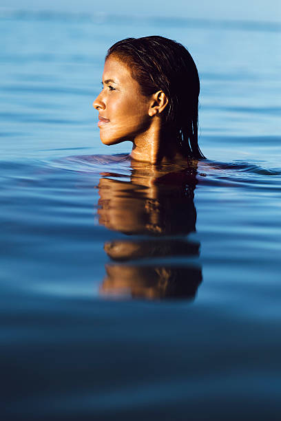 istock Fashion model taking a swim 472148137