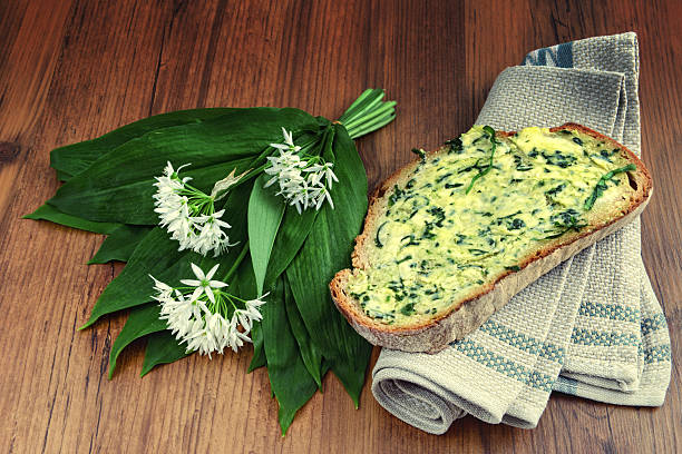 herb butter wild garlic (Allium ursinum) on slice of bread herb butter wild garlic (Allium ursinum) on slice of bread. zigeunerlauch stock pictures, royalty-free photos & images