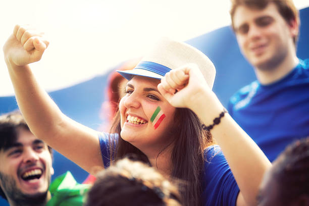 istock Sports fans cheering a game 472149077