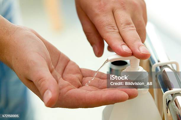 Close Up Of Hands Squirting Disinfectant From A Pump Bottle Stock Photo - Download Image Now