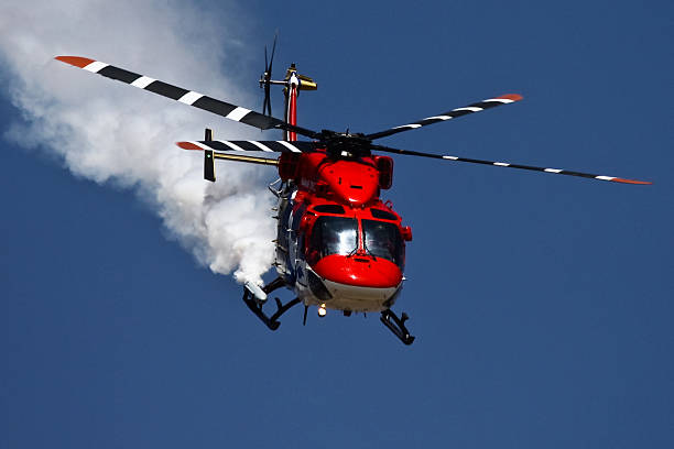 istock Helicopter with smoky trail 472150009