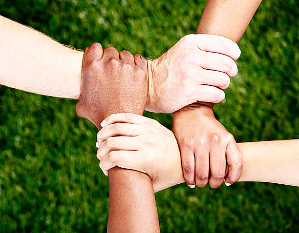 Friends Forever Four Hands Clasped In Square Against Grassy Background  Stock Photo - Download Image Now - iStock