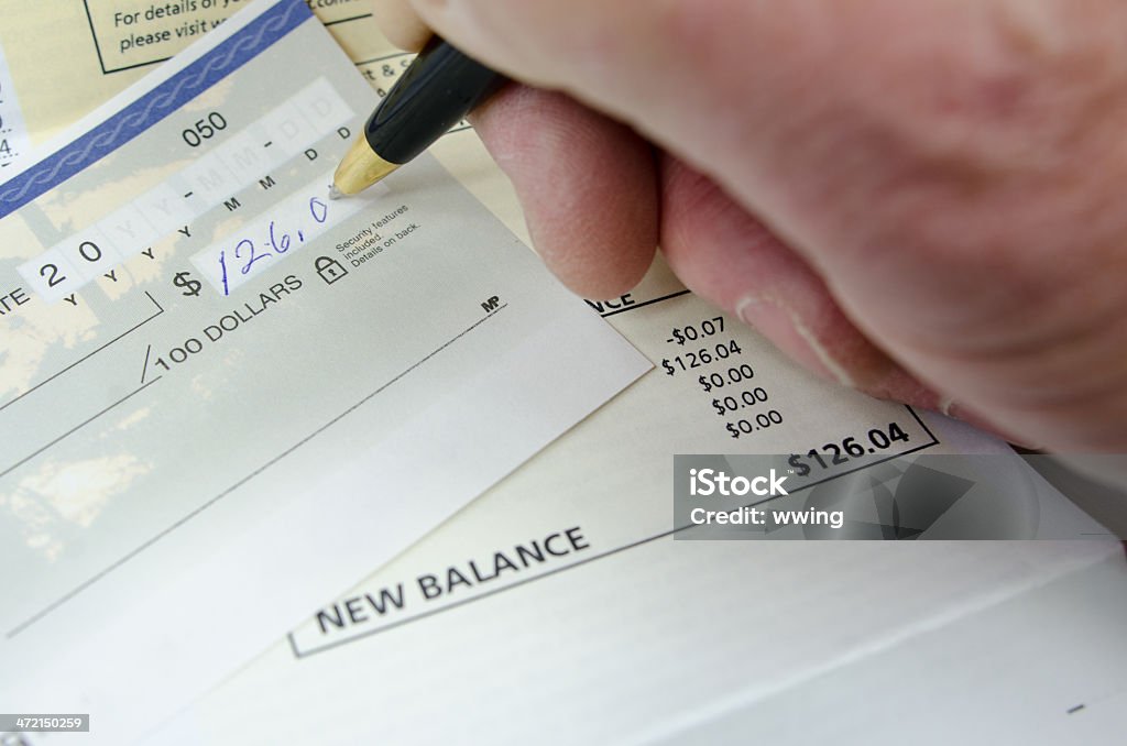 Paying With Check Paying A Bill Check Stock Photo - Download Image Now - Check ...