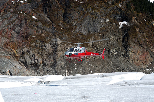 Juneau, USA - May 20, 2013: Helicopter is landing on the Mendenhall Glacier in Juneau, Alaska