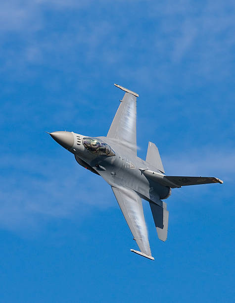 istock Wing Condensation on an F-16 Fighter Plane 472150797