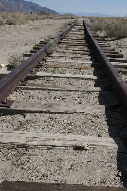 istock Old Wooden Railroad Tracks Leading Nowhere 472150916