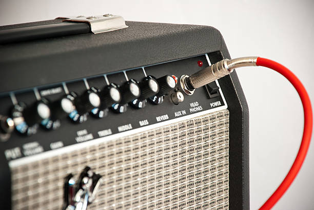 guitar amplifier black guitar amplifier with red cord amplifier plug stock pictures, royalty-free photos & images
