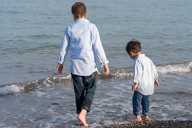 istock Children on the Beach 472151536
