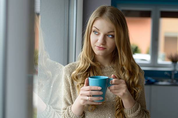 istock Beautiful  blond woman drinking coffee 472151894