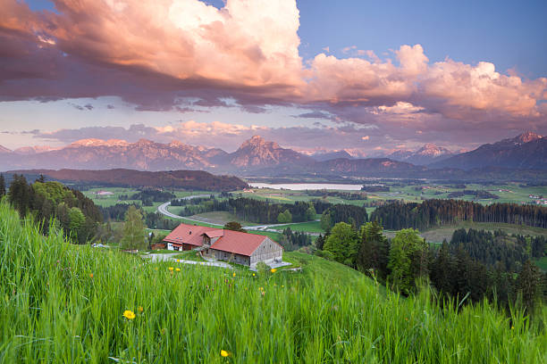 dramatic sunset above alpe beichlstein, allgaeu,, bavaria, lake hopfensee and mt saueling in the background