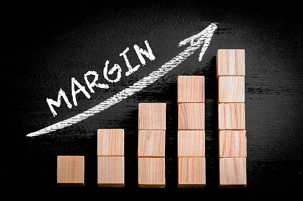 istock Word Margin on ascending arrow above bar graph 472152224
