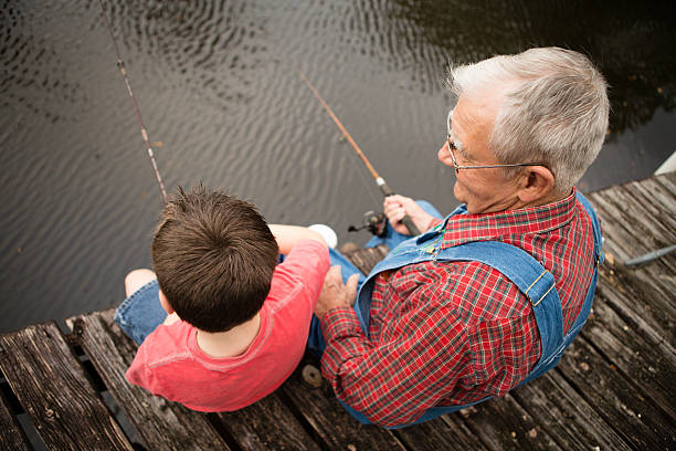 istock Fishing With Grandpa, Rear View 472152437