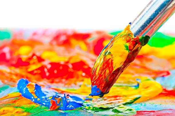 istock brush stained with acrylic paints, close-up shot 472152458