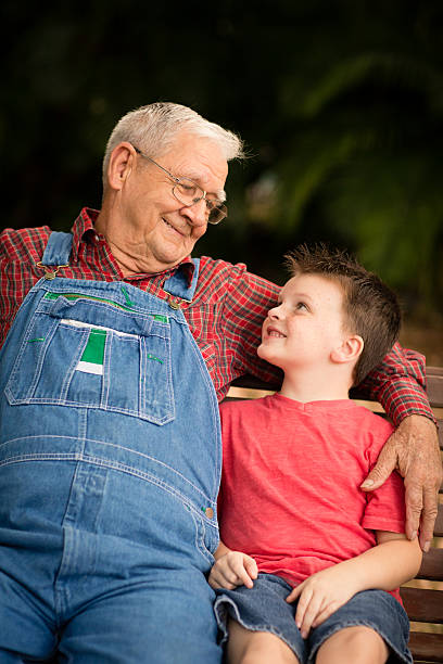 istock Young Boy Smiling at His Great Grandfather 472152461