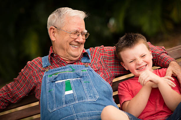 istock Young Boy Laughing With His Great Grandfather 472152465