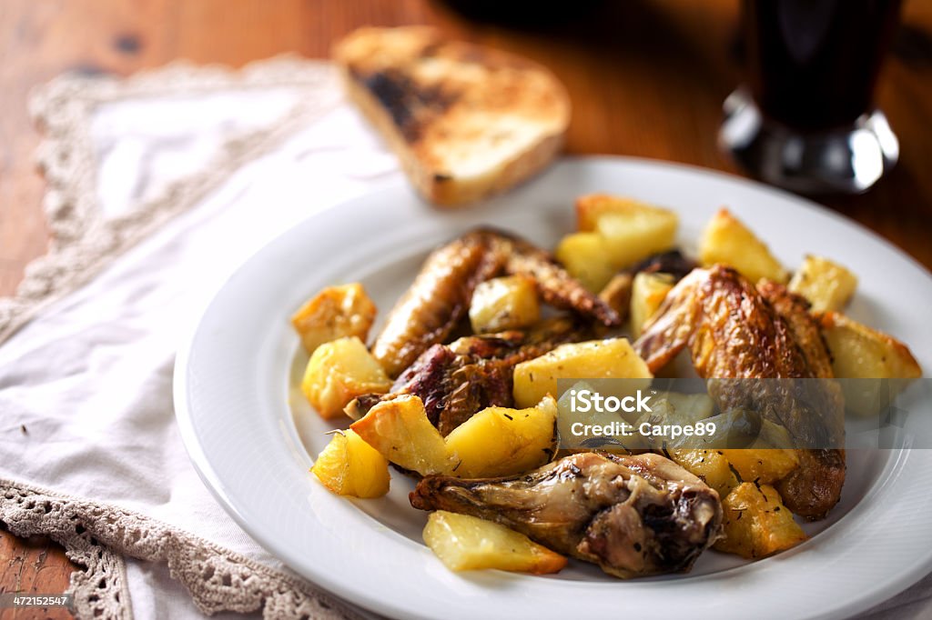 Chicken and baked potatoes American Culture Stock Photo