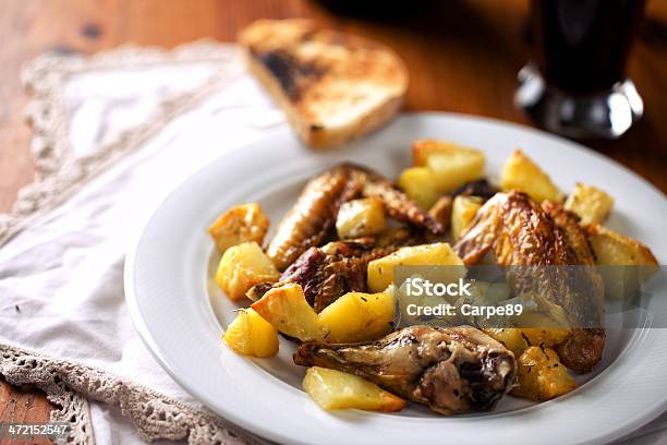 Chicken And Baked Potatoes Stock Photo - Download Image Now - American Culture, Animal Body Part, Animal Leg