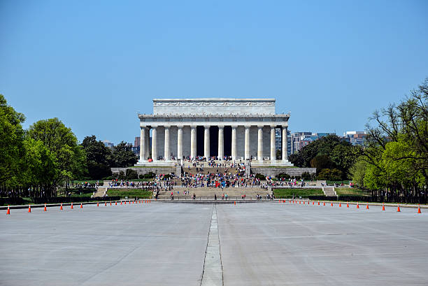 Empty Reflecting Pool Centered on Lincoln Memorial in April Daylight Washington, DC, USA - April 18, 2015: Empty Reflecting Pool Centered on Lincoln Memorial in April Daylight  washington dc slavery the mall lincoln memorial stock pictures, royalty-free photos & images