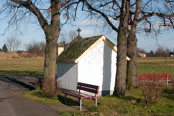 Rural landscape with a small chapel on hiking trails.