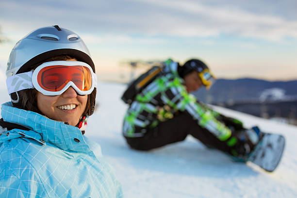 Snowboarder relaxing stock photo