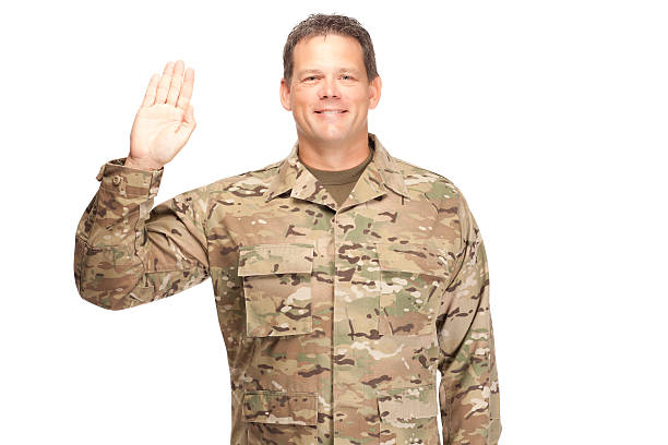 istock U.S. Army Soldier, Sergeant. Isolated. Hand up for oath. 472155516