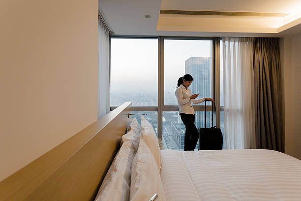 istock businesswoman in hotel 472155725