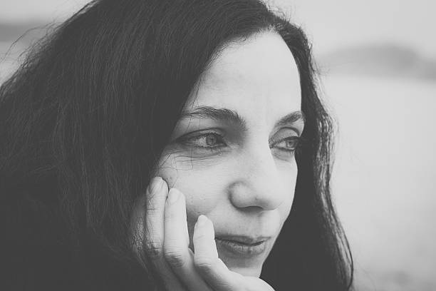 istock Smiling Woman Looking Away 472155729