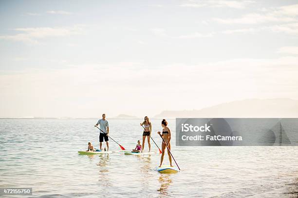 Beautiful Scenery When Paddleboarding Stock Photo - Download Image Now - Family, Hawaii Islands, Paddleboarding