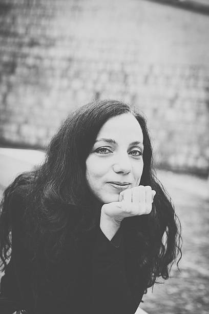 istock Smiling Woman Looking at Camera 472155753