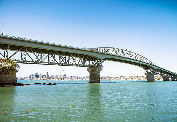 Auckland Skyline under the Harbour Bridge Auckland's skyline seen from below the north side of the Auckland Harbour Bridge. Waitemata Harbor stock pictures, royalty-free photos & images