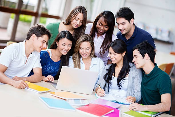 istock Group of students with a laptop 472156239
