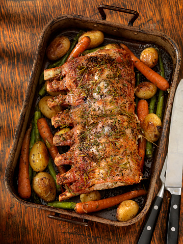Pork Loin Roast smothered in roasted Garlic, olive oil, fresh Herbs, sea salt and pepper with asparagus, baby potatoes, carrots and roasted to perfection-Photographed on Hasselblad H3D2-39mb Camera