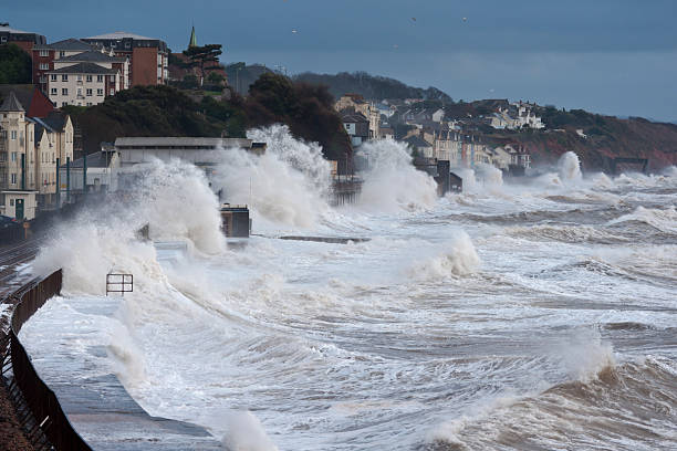 Severe storm at Dawlish with large waves over railway stock photo