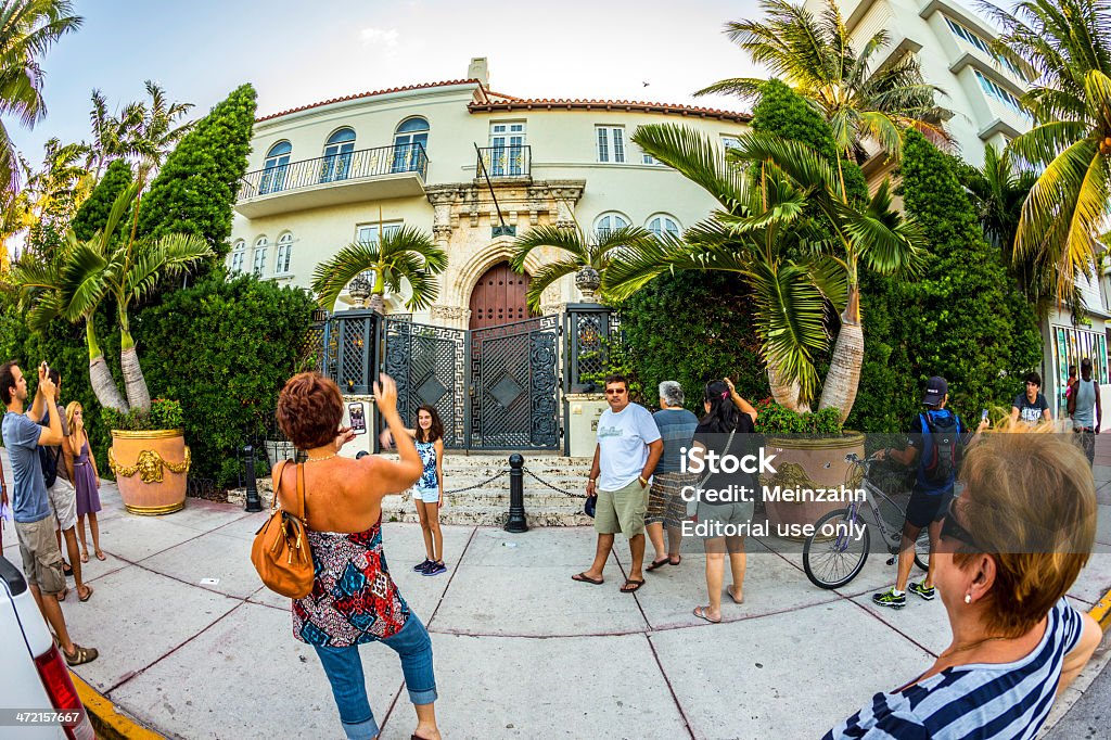 people visit the Versace mansion at ocean drive Miami, USA - July 31, 2013: people visit the Versace mansion. In 1997 the world gasped as Gianni Versace was shot to death on the doorstep of his Miami South Beach mansion in Miami, USA. Camera - Photographic Equipment Stock Photo